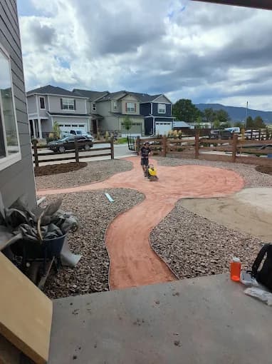 Front-yard walkway and rock-bed installation in a Colorado Springs neighborhood